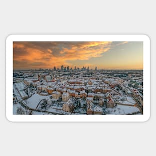 Warsaw old town, snow-covered roofs and and distant city center at dusk Sticker